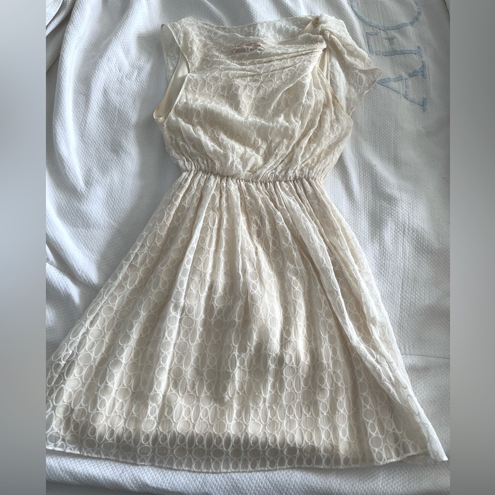 XS Alice + Olivia white mini dress with draping on one shoulder. In GUC